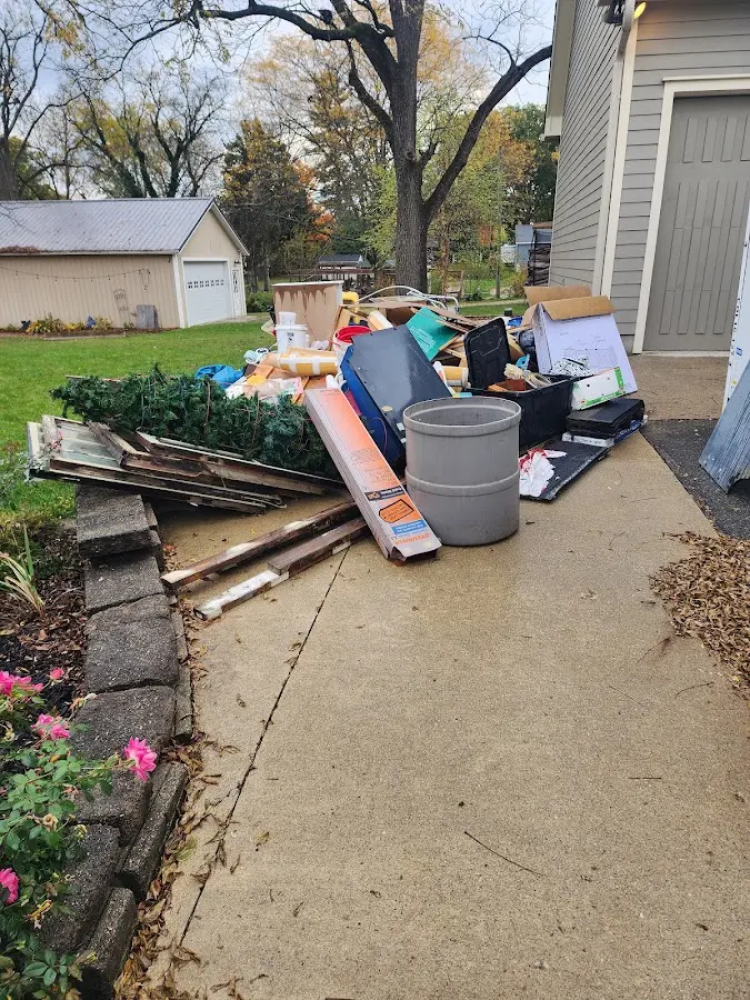 Dumpster being loaded with debris for Roofing Dumpster Rental in Guadalupe